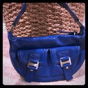 Blue Michael Kors purse.